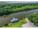 Aerial view of a private boat dock with boat slips providing convenient waterfront access and recreational opportunities at 39653 Grove Hts, Lady Lake, FL 32159
