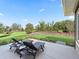 Relaxing backyard with patio seating and a lush, landscaped garden area at 39653 Grove Hts, Lady Lake, FL 32159