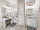 Beautiful bathroom with dual vanities, mirrors, and granite countertops at 39653 Grove Hts, Lady Lake, FL 32159