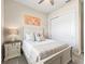 Comfortable bedroom with a ceiling fan, neutral decor, and a closet with sliding doors at 39653 Grove Hts, Lady Lake, FL 32159