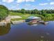 Aerial view of a private boat dock with multiple boat slips providing convenient waterfront access and recreational opportunities at 39653 Grove Hts, Lady Lake, FL 32159