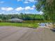 Exterior view of a private dock and boat lift on the water, providing easy access to boating and waterfront activities at 39653 Grove Hts, Lady Lake, FL 32159