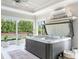 Indoor hot tub with multiple windows and ceiling fan at 39653 Grove Hts, Lady Lake, FL 32159