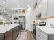 Well-equipped kitchen featuring stainless steel appliances, center island and modern cabinetry at 39653 Grove Hts, Lady Lake, FL 32159