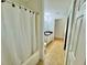 A clean bathroom with a bathtub, shower and single sink vanity at 40226 Palm St, Lady Lake, FL 32159