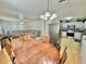An open concept space including kitchen, dining, and living room at 40226 Palm St, Lady Lake, FL 32159