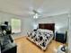 Spacious main bedroom with a window and bedside tables at 40226 Palm St, Lady Lake, FL 32159