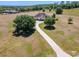 Expansive aerial view of the property highlighting the long driveway at 41522 Saddle Ridge Ln, Weirsdale, FL 32195