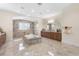 Spacious bathroom featuring a soaking tub, walk-in shower, double vanity, and refined tile flooring at 41522 Saddle Ridge Ln, Weirsdale, FL 32195