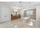 Lavish bathroom featuring double vanity, soaking tub, elegant tile, and a walk-in shower at 41522 Saddle Ridge Ln, Weirsdale, FL 32195