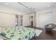 Spacious bedroom features dark floors, a canopy bed, and ample closet space at 41522 Saddle Ridge Ln, Weirsdale, FL 32195