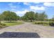 Long, winding brick driveway leads to this private, well-manicured property at 41522 Saddle Ridge Ln, Weirsdale, FL 32195