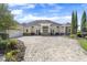 Stunning single-story home featuring a three-car garage and a circular driveway at 41522 Saddle Ridge Ln, Weirsdale, FL 32195