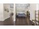 Expansive living room featuring hardwood floors, coffered ceilings, and a view of the pool area at 41522 Saddle Ridge Ln, Weirsdale, FL 32195
