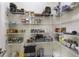 Walk-in pantry with multiple shelves and plenty of storage space at 41522 Saddle Ridge Ln, Weirsdale, FL 32195