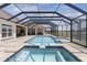 Luxurious private pool with spa and screened enclosure, perfect for outdoor relaxation and entertainment at 41522 Saddle Ridge Ln, Weirsdale, FL 32195