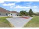 Exterior of a home with a sports court for outdoor activities, providing an active lifestyle at 41522 Saddle Ridge Ln, Weirsdale, FL 32195