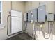 Tesla Powerwall home battery and electric meter on the side of the home at 41522 Saddle Ridge Ln, Weirsdale, FL 32195