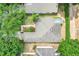 Overhead view of a home with mature landscaping and a gray roof, set within a quiet neighborhood at 4167 Capland Ave, Clermont, FL 34711