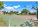Community basketball court for residents featuring multiple hoops and mature shade trees at 4167 Capland Ave, Clermont, FL 34711
