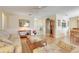 Inviting living room with hardwood floors, neutral walls, and open access to the dining area at 4167 Capland Ave, Clermont, FL 34711