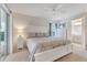 Bright main bedroom featuring carpet, ensuite bathroom, and sliding glass doors at 4167 Capland Ave, Clermont, FL 34711