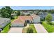 Wide aerial view of the home showcasing its premium lot, manicured lawn and landscaping at 4320 Heritage Trl, Leesburg, FL 34748
