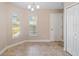 Bright dining area with tile floors, natural light, and closet at 4320 Heritage Trl, Leesburg, FL 34748