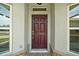Close-up of the front door, highlighting its classic design and inviting entrance at 4320 Heritage Trl, Leesburg, FL 34748