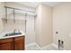 Functional laundry room with sink, cabinet, and shelving at 4320 Heritage Trl, Leesburg, FL 34748