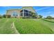 A well-maintained home surrounded by lush greenery, showing impeccable landscaping at 4720 Summerbridge Cir, Leesburg, FL 34748