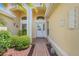 Inviting front entrance with manicured landscaping, arched entryway, and decorative accents at 4720 Summerbridge Cir, Leesburg, FL 34748