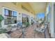 Spacious lanai with comfortable seating and views of lush landscaping at 4720 Summerbridge Cir, Leesburg, FL 34748