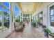Bright and airy lanai with comfortable seating and views of the surrounding landscape at 4720 Summerbridge Cir, Leesburg, FL 34748