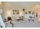 Comfortable living room featuring neutral tones, archways, and elegant furnishings at 4720 Summerbridge Cir, Leesburg, FL 34748