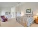 Well-lit main bedroom features a vaulted ceiling, neutral walls, and access to the en-suite bathroom at 4720 Summerbridge Cir, Leesburg, FL 34748