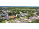 Scenic aerial shot of a residential area featuring diverse home styles and mature landscaping at 4908 Cape Hatteras Dr, Clermont, FL 34714