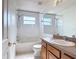 Full bathroom with shower over tub, vanity with sink and mirror at 4908 Cape Hatteras Dr, Clermont, FL 34714