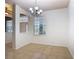 The well-lit dining room features an elegant chandelier and a large window with outdoor views at 4908 Cape Hatteras Dr, Clermont, FL 34714