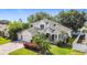 Stunning home with manicured lawn and colorful landscaping at 4908 Cape Hatteras Dr, Clermont, FL 34714