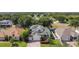 Charming two-story home with a well-manicured lawn, attached garage, and inviting entrance at 4908 Cape Hatteras Dr, Clermont, FL 34714