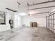 A two car garage with a water heater, water softener system, and access door to the home's interior at 4908 Cape Hatteras Dr, Clermont, FL 34714