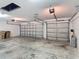 The three car garage has overhead lighting, multiple garage door openers, and plenty of storage space at 4908 Cape Hatteras Dr, Clermont, FL 34714