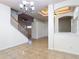Open living room featuring a staircase and access to other rooms at 4908 Cape Hatteras Dr, Clermont, FL 34714