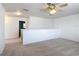 Upstairs loft area offering flexible space for living or entertaining with neutral carpet at 4908 Cape Hatteras Dr, Clermont, FL 34714
