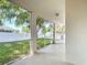Enclosed back patio with screened windows providing a view of the yard at 4908 Cape Hatteras Dr, Clermont, FL 34714