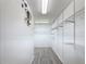 Walk-in closet with wire shelving and laminate wood flooring at 4908 Cape Hatteras Dr, Clermont, FL 34714