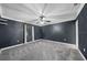 Spacious bedroom featuring new gray carpeting and ample natural light at 5011 Se 33Rd Ave, Ocala, FL 34480