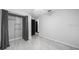 Bedroom with new gray flooring and a walk-in closet at 5011 Se 33Rd Ave, Ocala, FL 34480