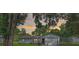 Charming single story home featuring a gray exterior, mature landscaping, and carport at 5011 Se 33Rd Ave, Ocala, FL 34480